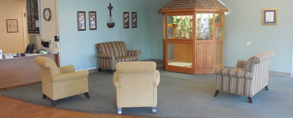 Interior seating area with chairs and a display case