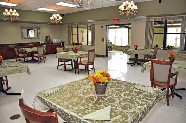 Dining area with tables and floral centerpieces