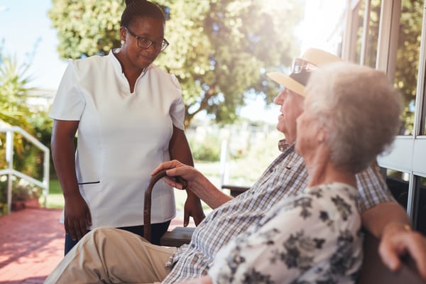 Care staff engaging with residents outdoors