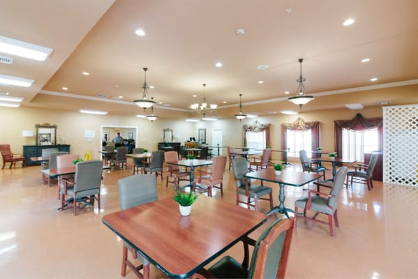 Bright and spacious dining area with tables and chairs