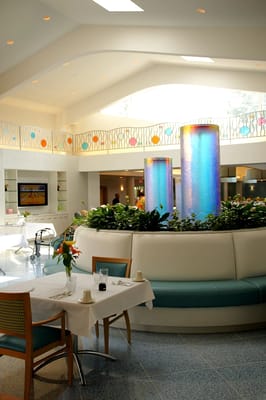 Bright interior common area with water feature