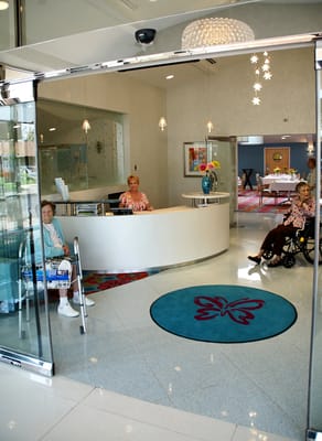 Residents and staff in a bright reception area