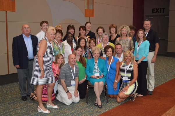 Group photo of staff and residents at an event