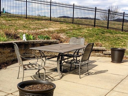 Outdoor patio area with seating and planters