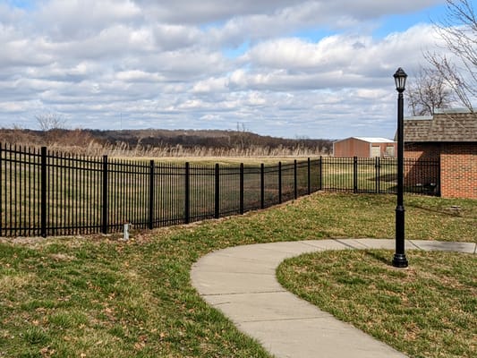 Pathway leading to a fenced outdoor area