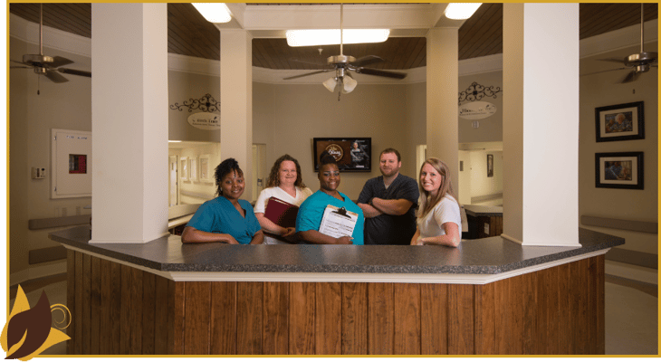 Staff members at a reception desk in the facility
