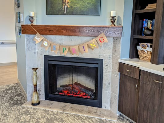 Cozy indoor fireplace with spring decorations