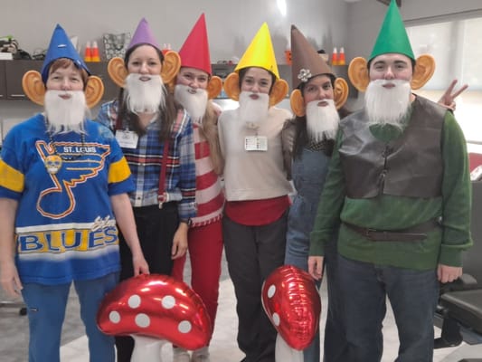 Residents and staff dressed in fun costumes during an activity