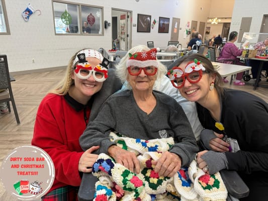 Residents and staff celebrating the holiday season together