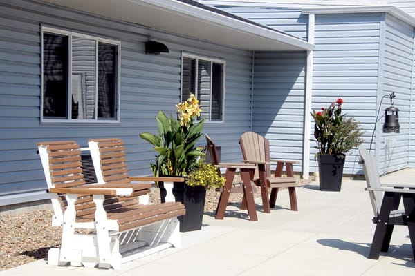 Seating area with plants outside the facility