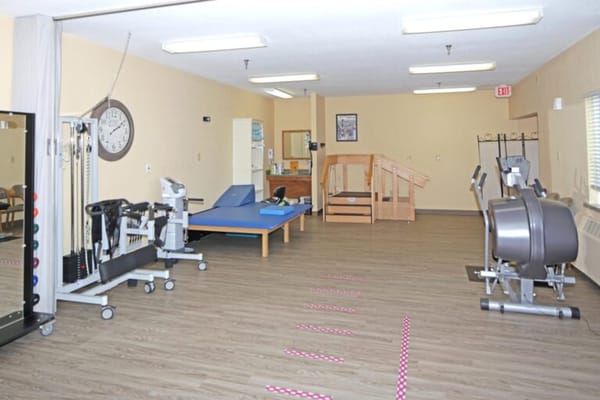 Interior view of a therapy room with exercise equipment