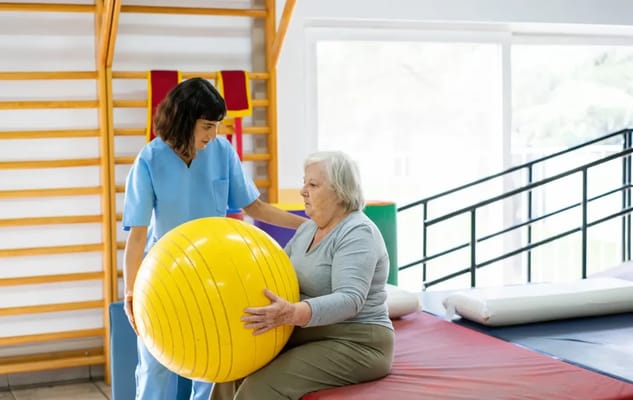 A resident engaging in therapy with a staff member
