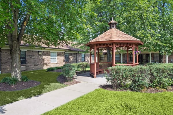 Outdoor gazebo surrounded by greenery at the facility