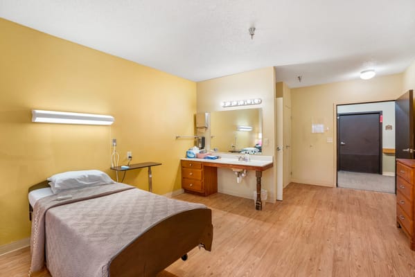 Private resident room with a bed and furnishings