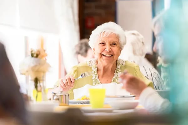 Senior enjoying a meal in a dining area