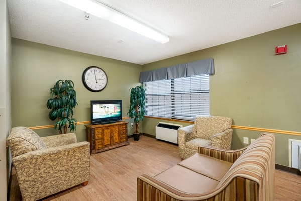 Common area with seating and television