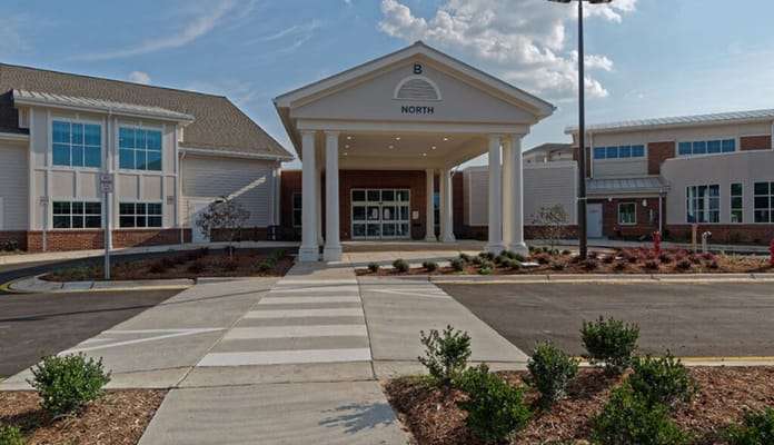 Front entrance of a senior living facility with walkways