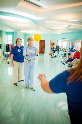 Residents participating in a recreational activity indoors