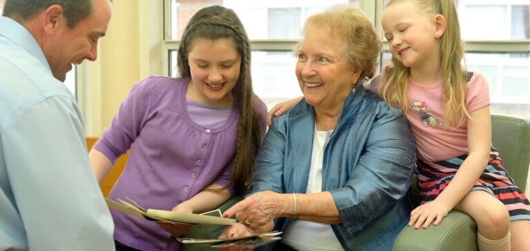 Seniors enjoying time with family in a bright room