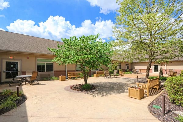 Outdoor courtyard with benches and trees