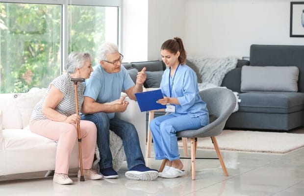 A caregiver discussing care options with residents