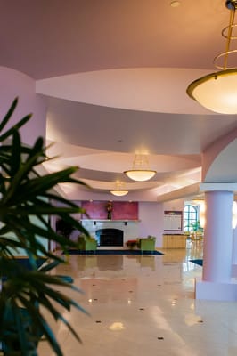 Interior view of a common area with seating and a fireplace