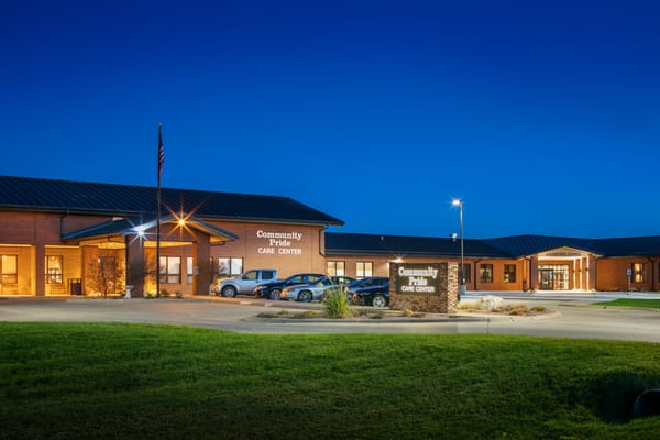Exterior view of the Community Pride Care Center at dusk
