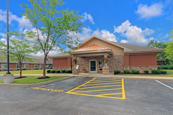 Exterior view of the facility with landscaped entrance