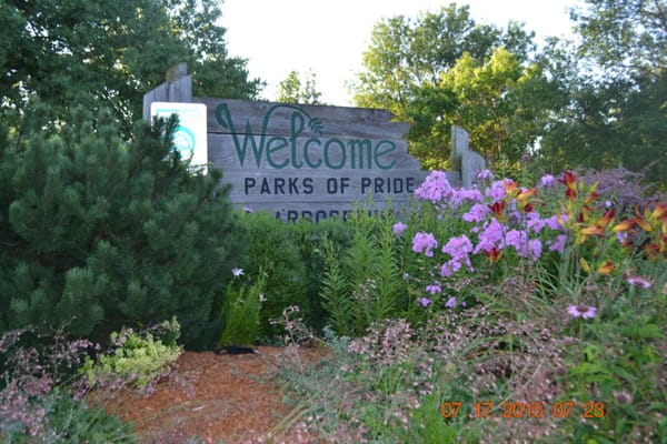 Welcome sign at a beautifully landscaped entrance