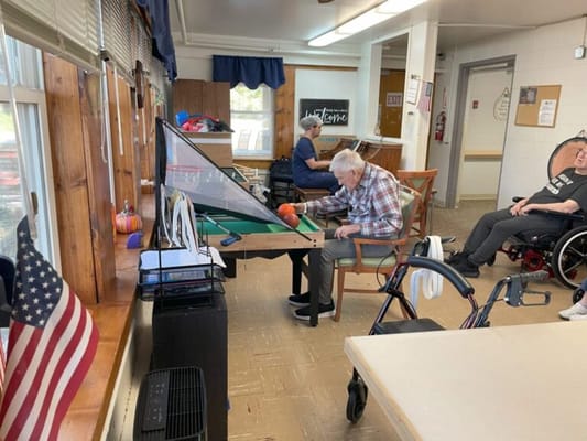 Seniors participating in a game activity in a common area