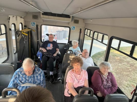 Residents enjoying a bus ride to an outing