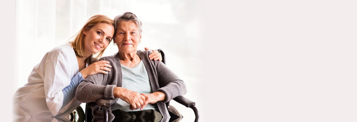 Caregiver with a resident in a bright indoor setting