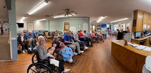 Residents enjoying an activity in the facility's common area