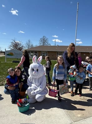 Children with baskets during an outdoor Easter event