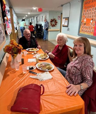 Residents enjoying a meal in the dining room
