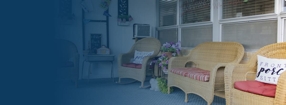 Cozy common area with wicker chairs and decor