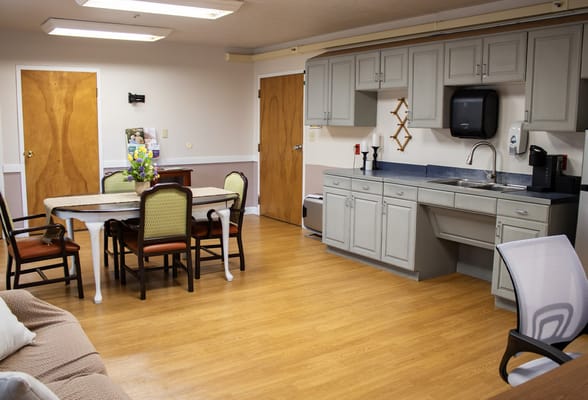 Cozy shared living space with dining area and kitchenette
