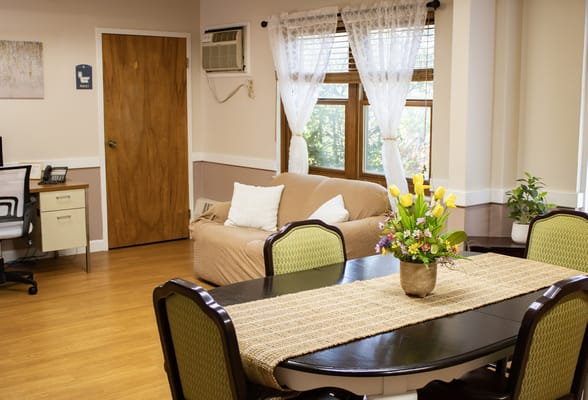 Cozy interior of a common area with flowers on the table