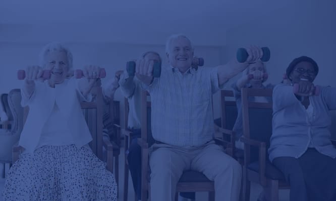 Residents participating in a seated exercise class