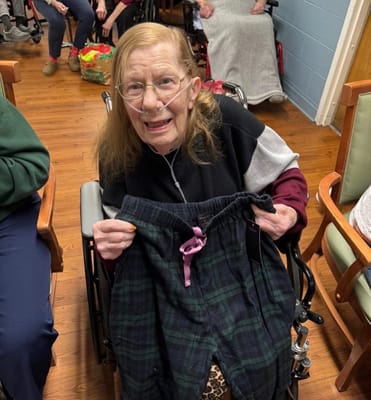 A resident showing new pants in a common area