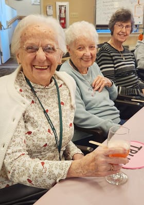 Three residents enjoying an activity in a common area