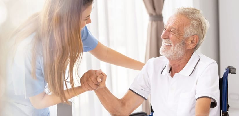 Caregiver interacting with a smiling resident