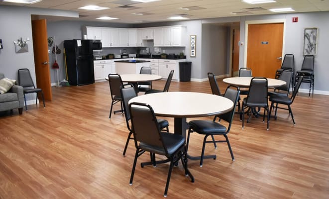 Bright common area with tables and chairs