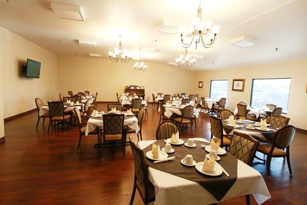 Dining room setup with neatly arranged tables and chairs
