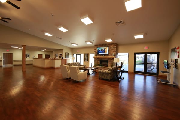 Bright common area with comfortable seating and a TV