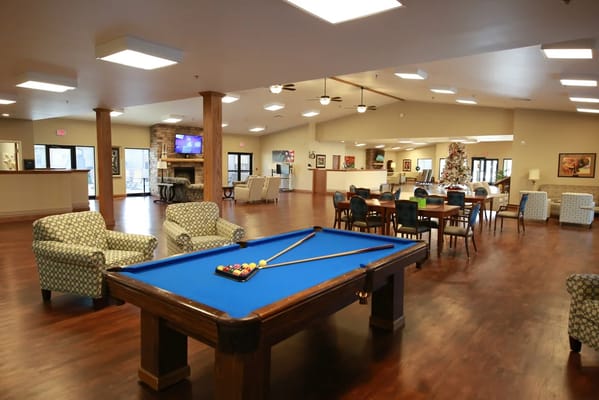 Interior common area with a pool table and seating