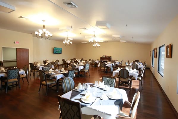 A spacious dining room with neatly set tables