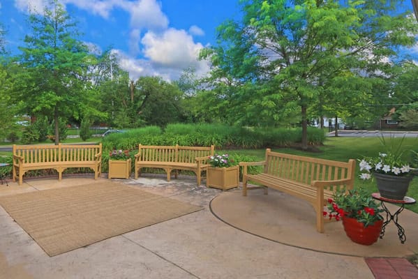 Outdoor seating area with benches and plants