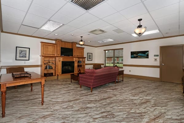Bright interior common area with seating and furniture