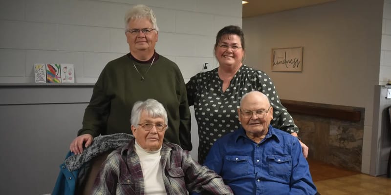 Staff and residents posing for a photo in the facility